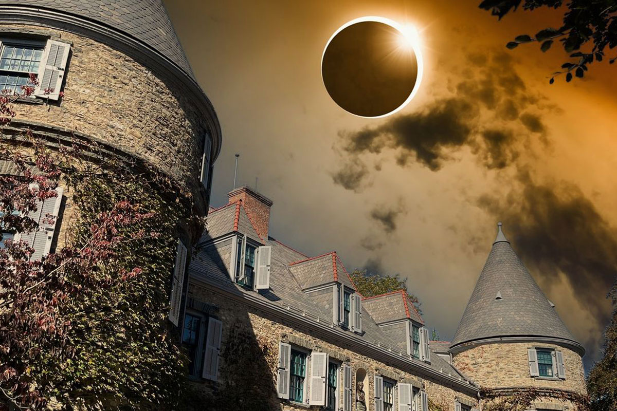 simulation of an eclipse of the sun above the Grey Towers mansion